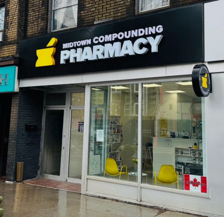 Midtown Compounding Pharmacy storefront on rainy city street