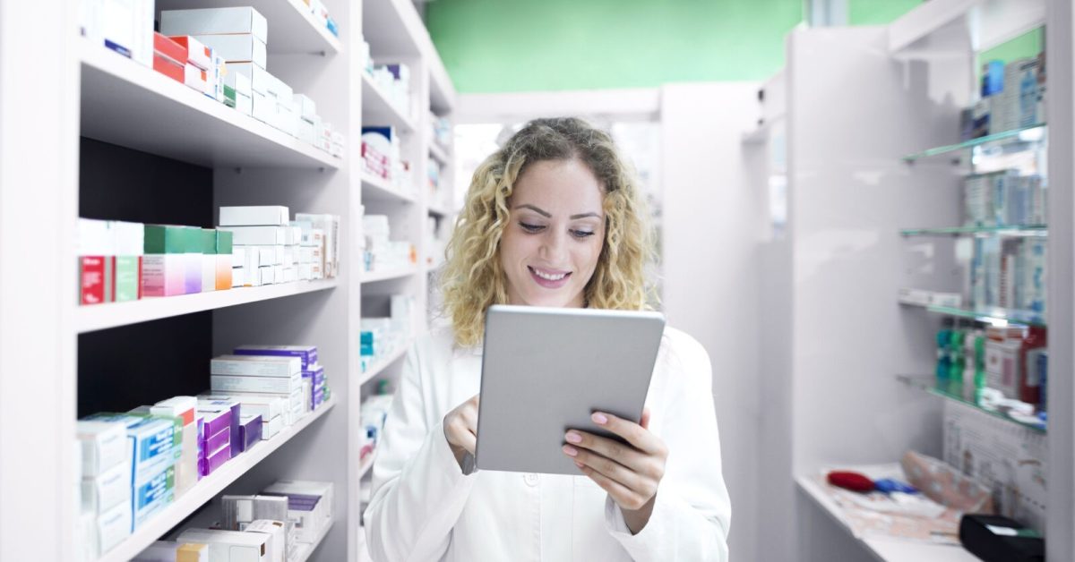 Female pharmacist working in drug store. Pharmacy Marketing